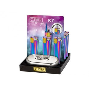 May include: A display of Clipper Jet lighters with an iridescent finish. The lighters are arranged in a vertical row on a black display stand. The display stand has a silver metal base with the Clipper logo. The lighters have a new top cover and are labeled "Icy".