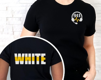 May include: A black short-sleeved t-shirt featuring a white 911 logo with a yellow heartbeat line and headset graphic on the chest. The circular inset shows the back of the shirt with the word WHITE printed in bold white and yellow letters.