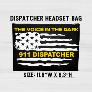 May include: Black and yellow 911 dispatcher headset bag with an American flag design. The bag reads "The Voice in the Dark" and "911 Dispatcher". The bag measures 11.8 inches wide by 8.3 inches high.