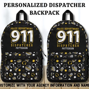 May include: Black backpack with a yellow and white star pattern. The backpack has a large white number 911 and the text "Police Department Dispatcher Patterson".