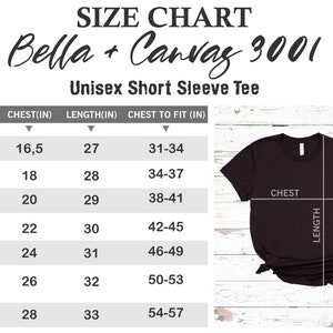 May include: Size chart for Bella + Canvas 3001 unisex short sleeve tee. The chart shows sizes XS to 3XL with corresponding chest and length measurements in inches. A black tee shirt is shown with measurements labeled for chest and length.