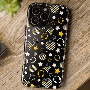 May include: Black phone case with a pattern of yellow and white stars, thin yellow stripes, and headphones. The case has a cutout for the camera lens.