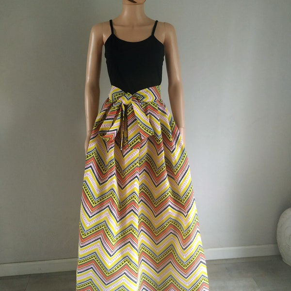 Maxi or short skirt length options pleated at the waist in graphic polyester wax