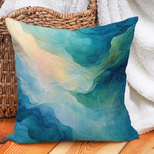 May include: A blue and green abstract cushion with swirling patterns. The cushion is made of soft fabric and has a subtle sheen.
