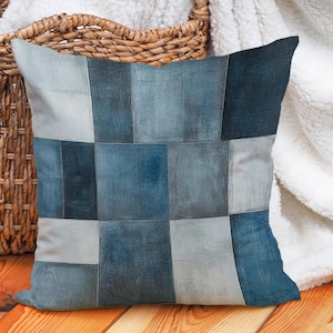 May include: A blue and white patchwork cushion with a geometric design. The cushion is made of a soft, comfortable fabric and is perfect for adding a touch of style to any room.