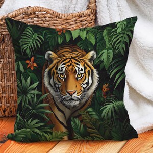 May include: A throw pillow featuring a vibrant green, orange and brown tiger print. The tiger is peeking out from behind lush green leaves.