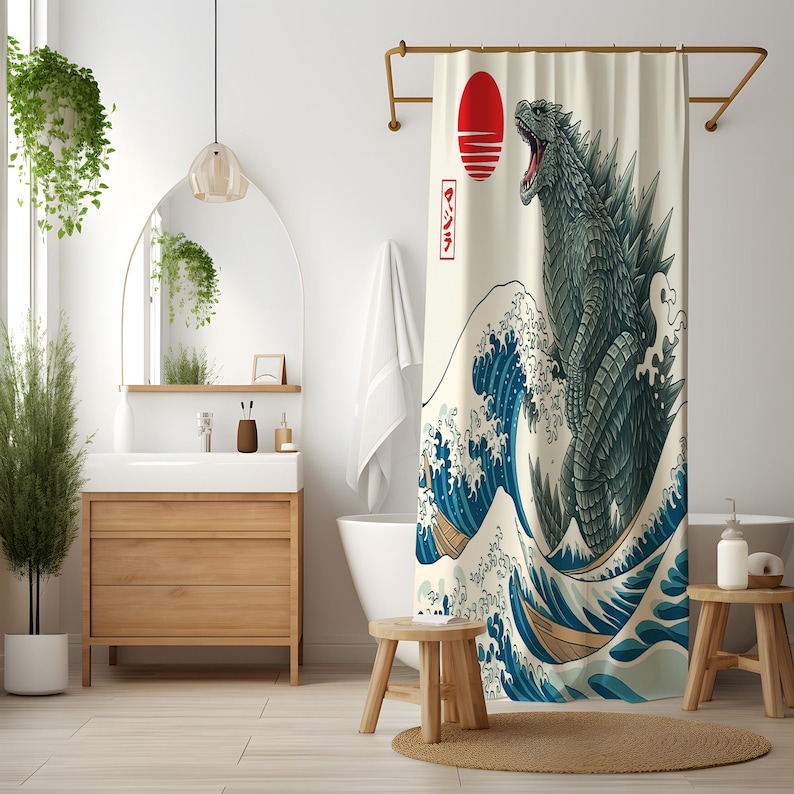 May include: A shower curtain featuring a Godzilla design in the style of The Great Wave off Kanagawa. The artwork depicts a red sun, a large wave, and a green Godzilla. The Japanese text "Godzilla" is also present.