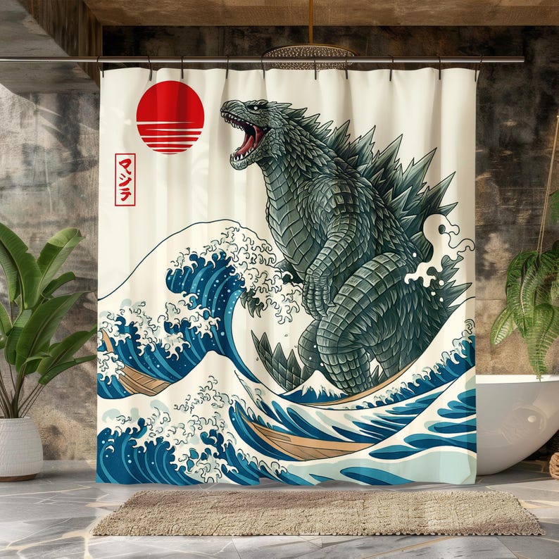 May include: A shower curtain featuring a Godzilla design in the style of a Japanese woodblock print. The design includes a red sun, blue waves, and Japanese text. The Godzilla is a dark green color.