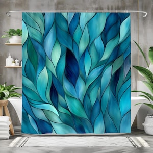 May include: Abstract shower curtain featuring a blue and teal pattern of overlapping leaves. The design is reminiscent of stained glass.