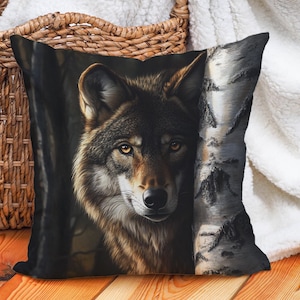 May include: A close-up of a wolf's face, with a dark background and a birch tree trunk to the right. The wolf has a brown and grey coat, with a sharp gaze.