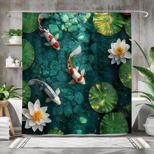 May include: A shower curtain featuring a green and blue watercolor design with three white and red koi fish swimming in a pond with lily pads and white water lilies.