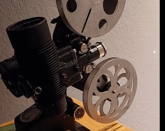 Bell & Howell 16mm Film Projector Filmo 57 Model JL w/Voltmeter W/ Woody Woodpecker Film