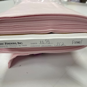 May include: Pink cotton flannel fabric, 16.5 yards, 100% cotton, #352, Fabric Finders, Inc., 4530 Helton Dr., Florence, AL 35630