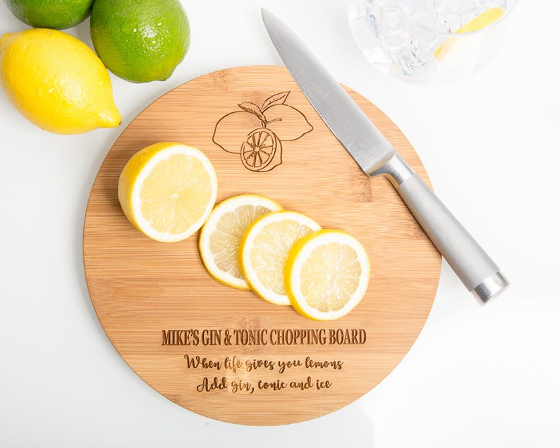 A personalised engraved bamboo wooden drinks chopping board.