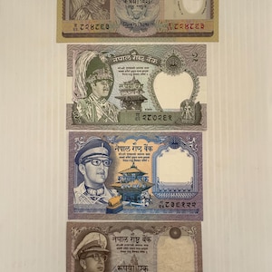 May include: Four Nepalese banknotes of varying denominations. The notes feature portraits of figures in formal attire, along with intricate designs and text in Nepali script. The banknotes are in shades of brown, purple, and blue.