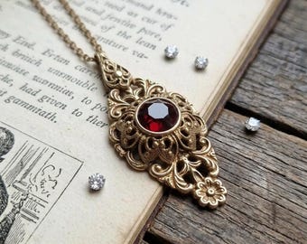 Victorian style brass filigree flower pendant necklace with Swarovski Ruby crystal