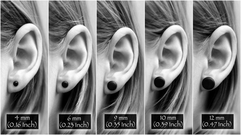 May include: Five black ear gauges of different sizes, shown in a person's ear. The gauges are 4 mm (0.16 inch), 6 mm (0.23 inch), 9 mm (0.35 inch), 10 mm (0.39 inch), and 12 mm (0.47 inch).