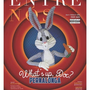 May include: A magazine cover featuring Bugs Bunny, a cartoon rabbit, in a crocheted form. The cover is red and white with the title "What's up, Doc?" and "Pernalonga" in large, bold letters. The magazine is a digital publication and is for subscribers only.