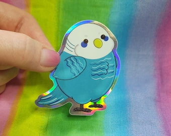 Bonita pegatina de papel de aluminio de un loro cuáquero azul