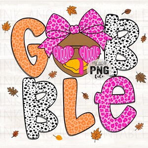 May include: A Thanksgiving-themed graphic with the word "GOBBLE" in large, colorful letters. The letters have various patterns, including leopard print and polka dots. A cartoon turkey wearing heart-shaped glasses and a bow is in the center. Autumn leaves are scattered around.