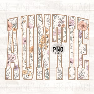 May include: Auntie floral design in a PNG file. The word "AUNTIE" is displayed in a bold, serif font, filled with a floral pattern of pink, yellow, and purple flowers. The design has a light brown outline and is set against a white background.