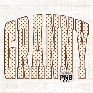 May include: The word GRANNY written in large, block-style letters with a cream-colored background and a brown polka dot pattern. The letters have a thick brown outline. A small circular logo in the bottom right corner reads PINK ANCHOR PNG file.