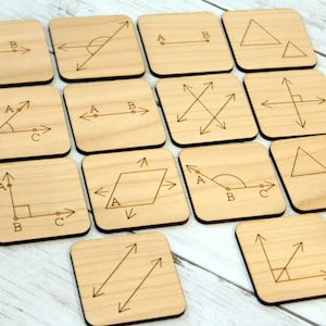 May include: A set of 12 wooden tiles with different geometric shapes and angles drawn on them. Each tile has letters A, B, and C to label the points of the shapes.