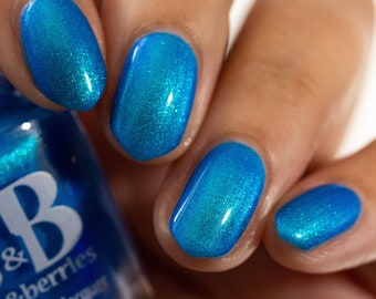 Here Fishy, Fishy - Jen & Berries indie nail polish, neon blue indie nail polish with gold to green shifting aurora shimmer.