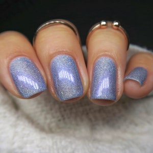 I See a Blue Star Rising Jen & Berries indie nail polish, pastel periwinkle blue linear holographic with purple shimmer, flecks, holo flakes