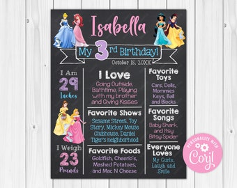 May include: A black chalkboard style birthday sign with a pink and purple border. The sign says "Isabella My 3rd Birthday!" with a date of October 15, 20XX. The sign also includes details about Isabella's age, height, weight, favorite activities, foods, and songs. The sign features images of Disney princesses.