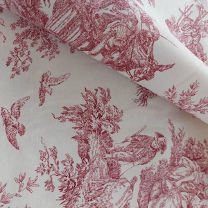 May include: Red toile fabric with a repeating pattern of birds, trees, and people hunting. The fabric has a white background and a subtle texture.