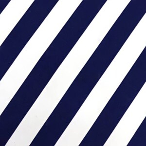 May include: A white and navy blue striped fabric with diagonal stripes.