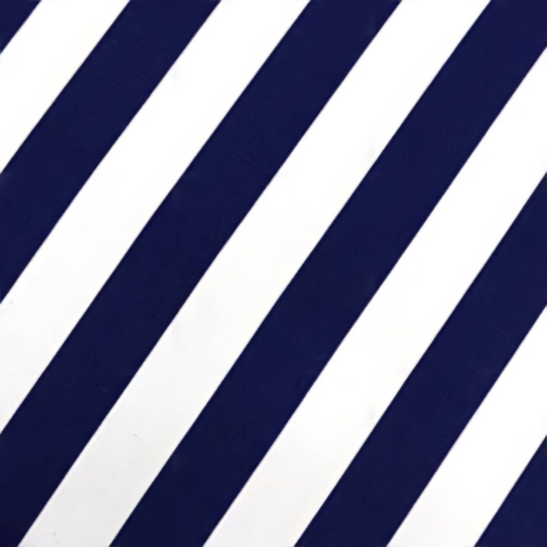 May include: A white and navy blue striped fabric with diagonal stripes.