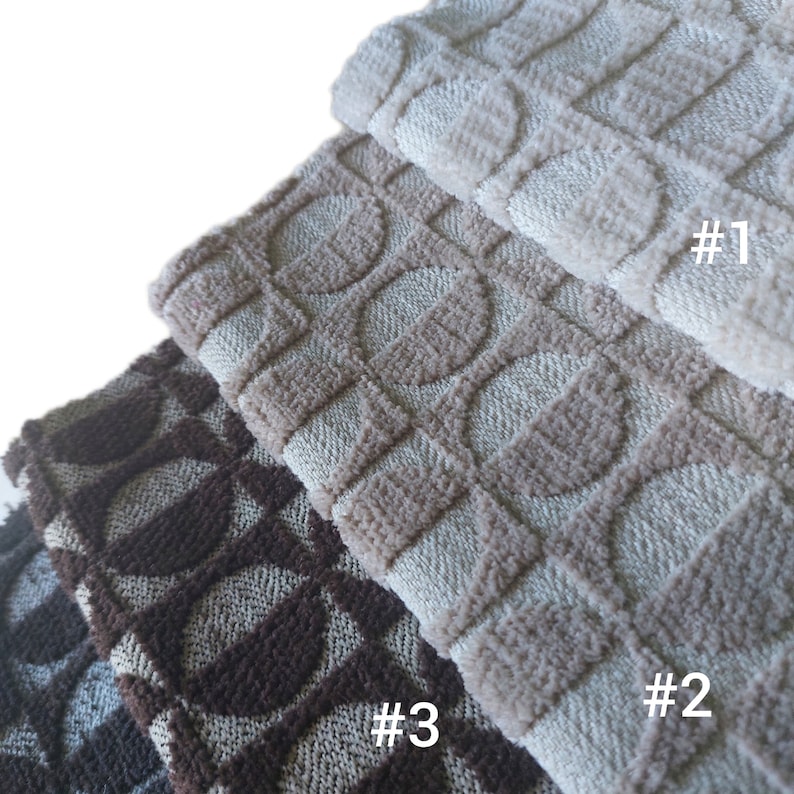 May include: Three fabric swatches with a geometric pattern of circles and squares. The top swatch is light beige, the middle swatch is a darker beige, and the bottom swatch is brown. The swatches are labeled #1, #2, and #3.