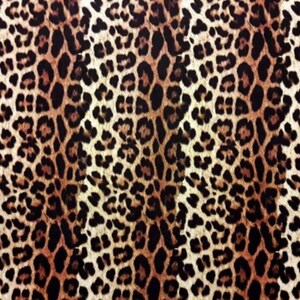 May include: A brown, black, and white leopard print fabric with a symmetrical pattern.