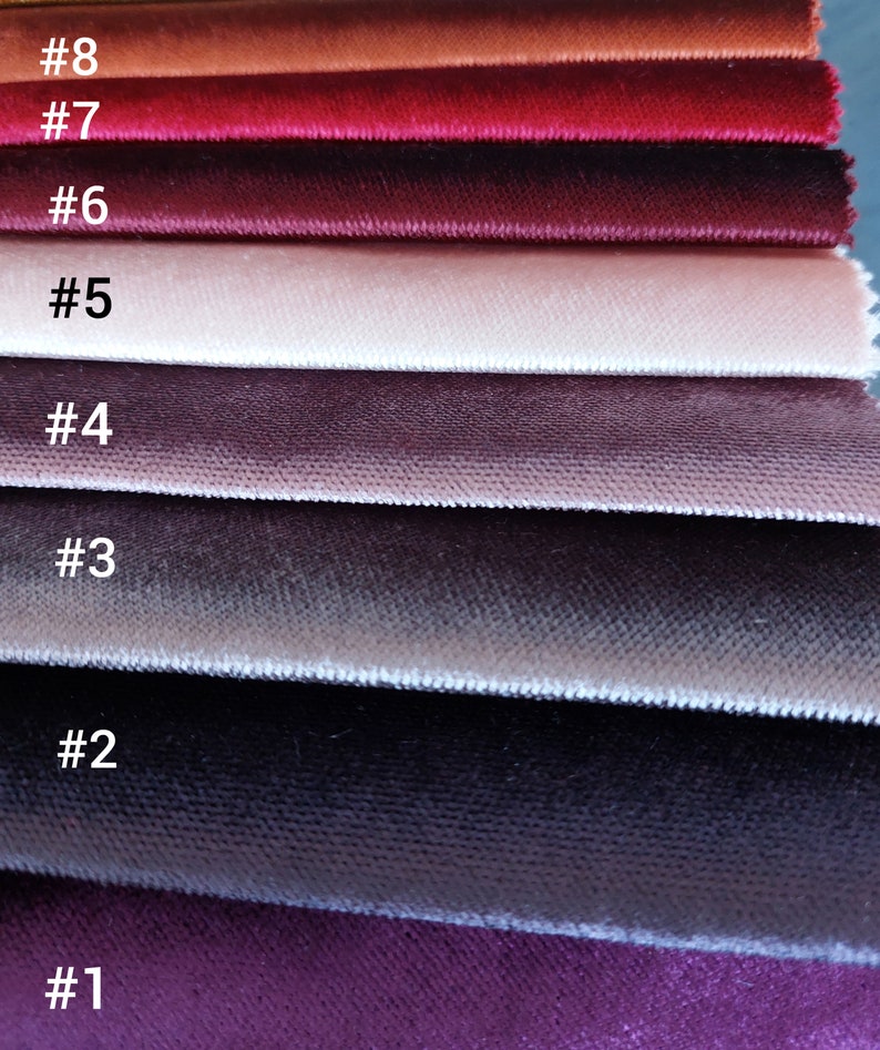 May include: Eight fabric swatches in various shades of red, pink, and purple. The swatches are numbered 1 through 8.
