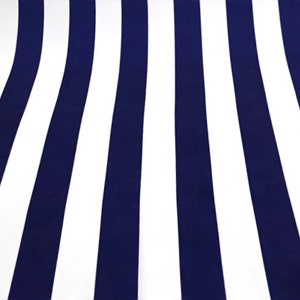 May include: A fabric with alternating navy blue and white stripes. The stripes are vertical and run the length of the fabric.