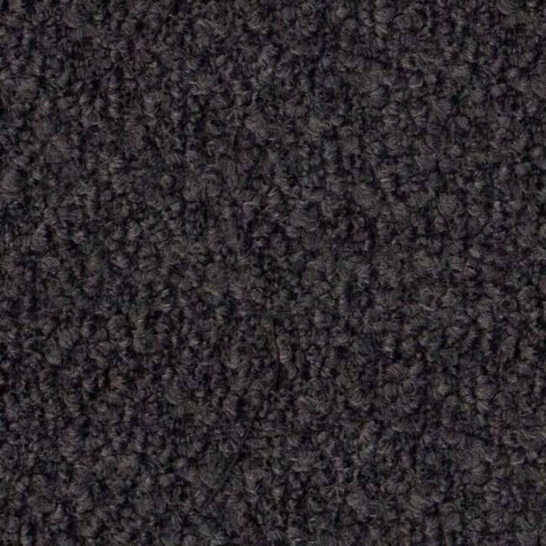 May include: Close-up of a dark gray, textured fabric with a fuzzy, looped surface.