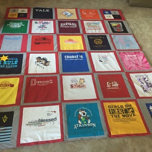 May include: A quilt made from a variety of t-shirts, featuring logos and text from different organizations and events. The quilt is made up of 25 squares, each with a different design. Some of the designs include the words "Yale", "Harvard", "Cohort 16", "I Rule the Ranch", "Haiti", "Blessed Opportunity", "Girls on the Move", and "Shanghai".