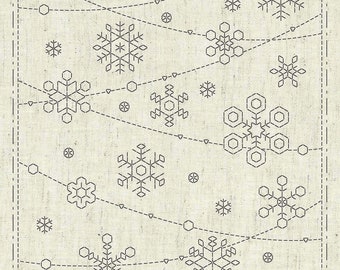 May include: A beige fabric with a pattern of black snowflakes. The fabric has a subtle texture and a slightly distressed look. The text "KF2021-31 - Sashiko Cloth "Holy Night" - Designed by Ky Fujita for QH Textiles ©2021" is at the bottom of the fabric.
