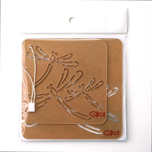 May include: Two brown cardboard stencils featuring a dragonfly design. The stencils are layered on top of each other and have a white string attached to the top. The stencils are packaged in a clear plastic bag.