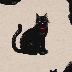 May include: A pattern of black cats on a white background. The cats are in various poses, some are sitting, some are standing, and some are curled up. One cat is wearing a red collar.