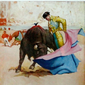 May include: A painting depicting a bullfight. A matador in a yellow and gold suit is facing a black bull. The matador is holding a pink and blue cape. The bull is charging at the matador. The painting is signed "Rafael Rodriguez" in the lower right corner. The text "Un Remate" is below the signature.