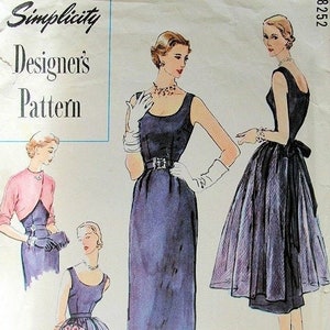 May include: Vintage Simplicity Designer's Pattern sewing pattern for a sleeveless dress with a fitted bodice and a full skirt. The pattern is for size 12 and costs 50 cents.
