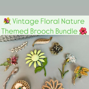 May include: A bundle of vintage floral and nature-themed brooches. The brooches feature a variety of designs, including flowers, leaves, and a single stem with a rhinestone flower. The brooches are made of metal and rhinestones.