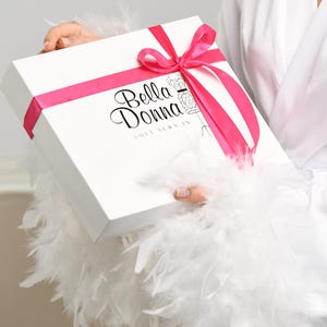 Luxury bridal gift box with ‘Bella Donna’ logo and a pink satin ribbon bow. Perfect for wedding morning or special occasions.
