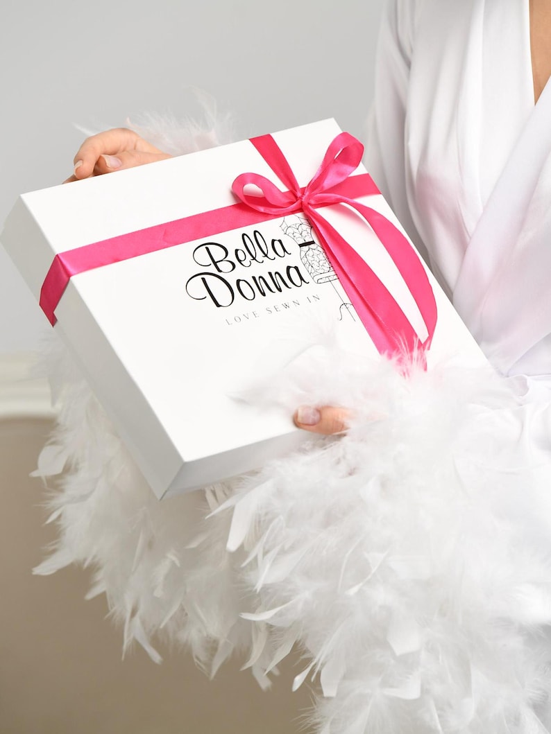 Luxury bridal gift box with ‘Bella Donna’ logo and a pink satin ribbon bow. Perfect for wedding morning or special occasions.