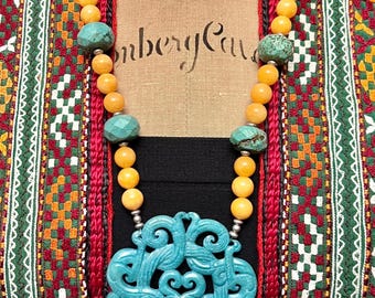 Hand carved teal jade medallion pendant with turquoise and yellow jade gemstone handmade unique bohemian statement necklace.