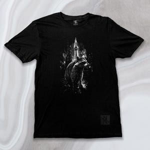 Front view of the Noir et Noir Toronto Urban Raccoon T-shirt, showcasing the unique black-on-black raccoon design. Perfect for urban fashion and raccoon enthusiasts. Available now in the Toronto Collection.