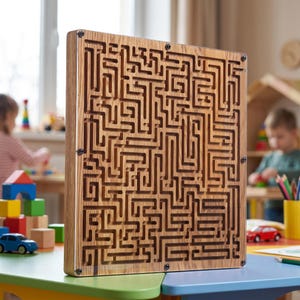 May include: A square wooden maze puzzle featuring a complex network of carved channels. The light brown wood grain is visible throughout the structure, which is secured with four black metal screws at the corners and sides, holding a clear front panel.